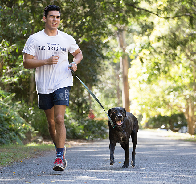 RSPCA Volunteer hiking in the bush with his dog